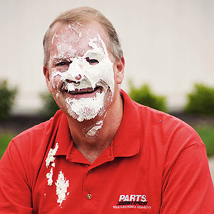 Company President Jeff Stahl in good spirits after receiving a whipped cream pie to the face.