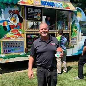 Company President Jeff Stahl enjoying some Kona Ice with employees outside of our offices.