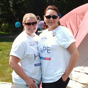 Two employees at Relay for Life in 2009.
